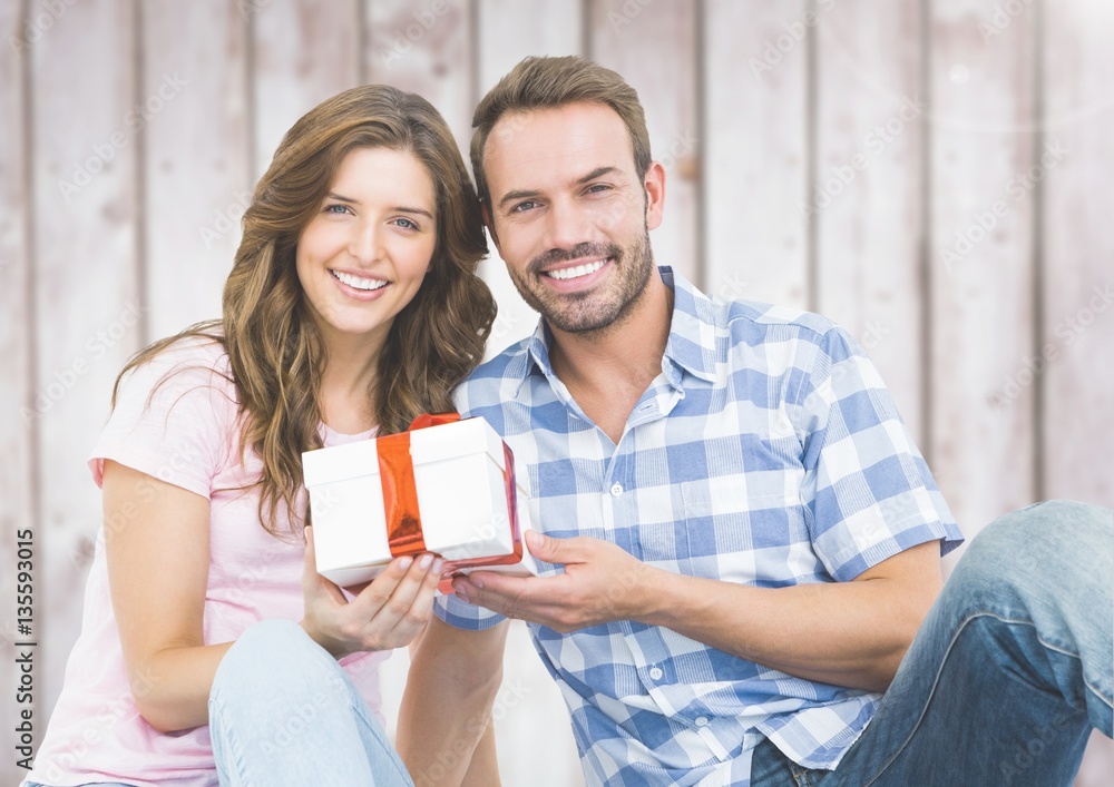 Man giving a gift to woman