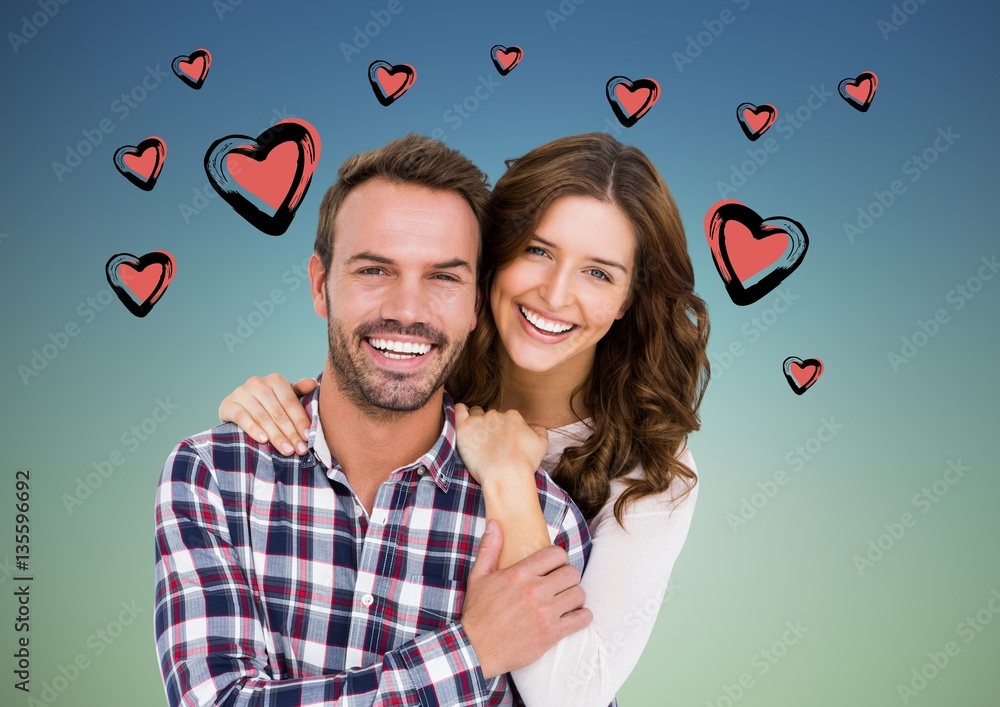 Portrait of couple against hearts background