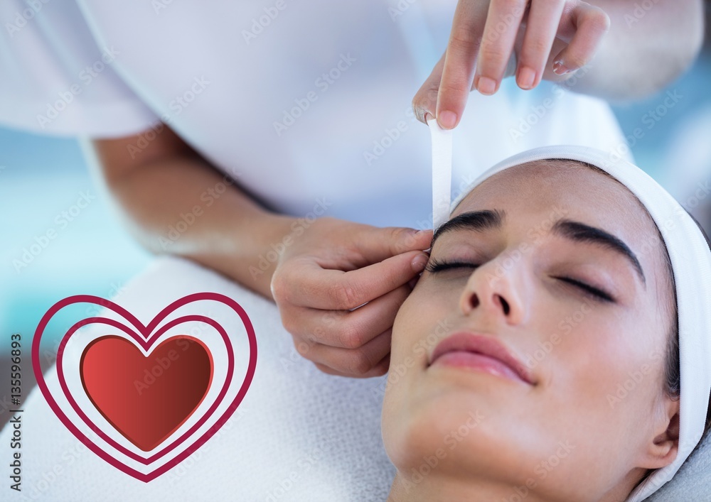 Woman receiving massage at spa center