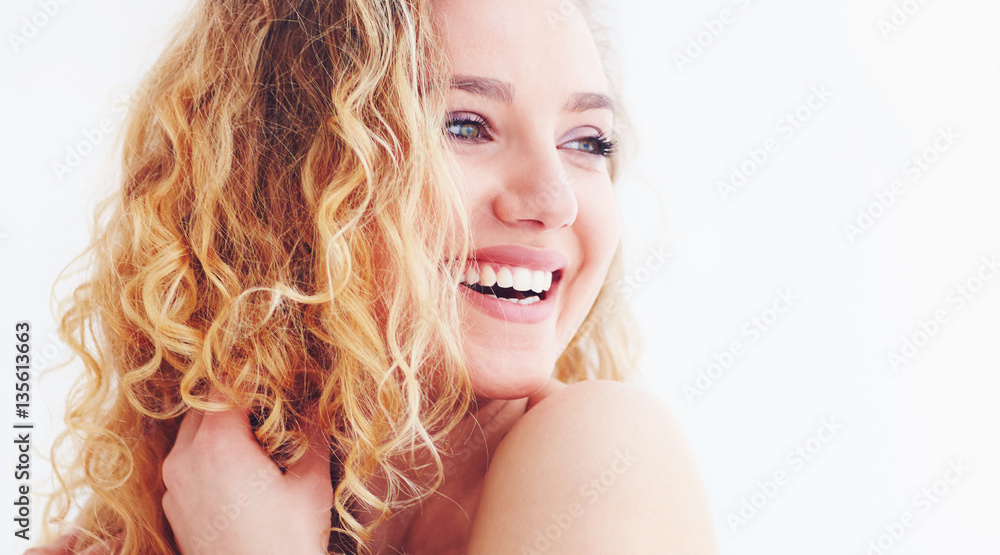 beautiful happy woman with curly hair