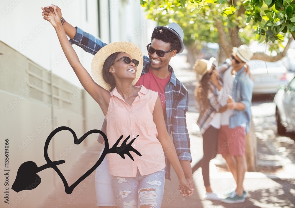 Happy couple dancing on street