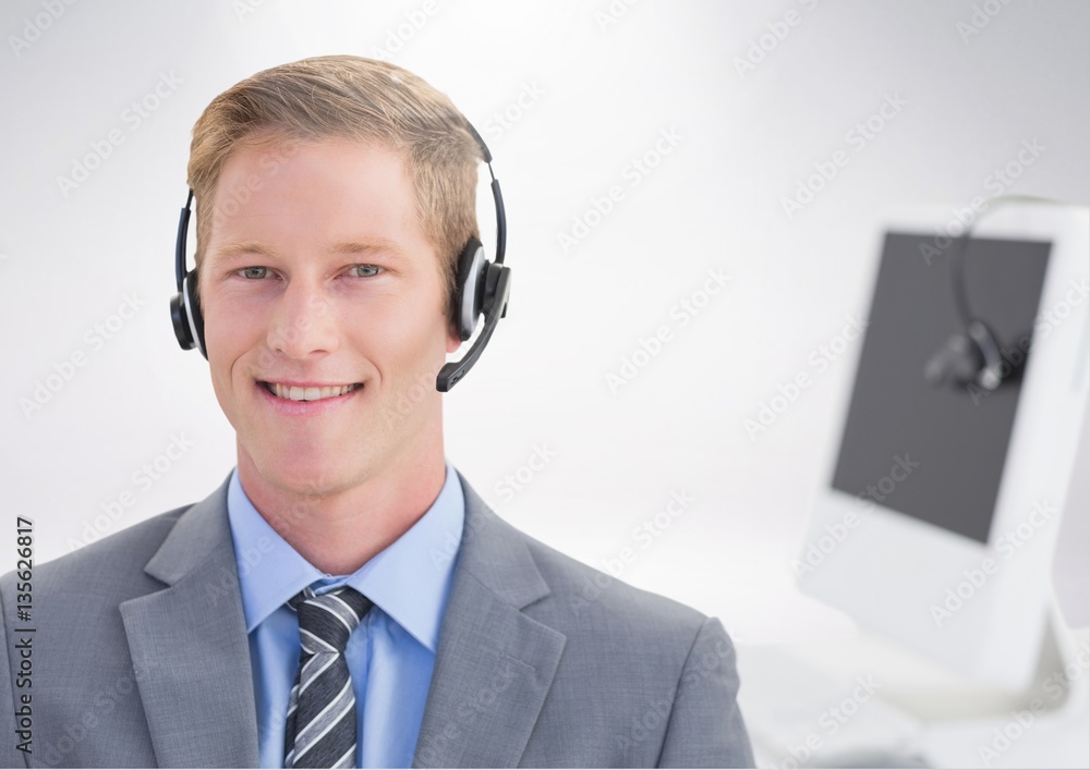 Portrait of smiling businessman with headset