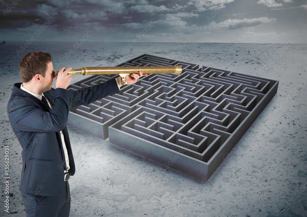 Businessman standing in maze and looking from telescope