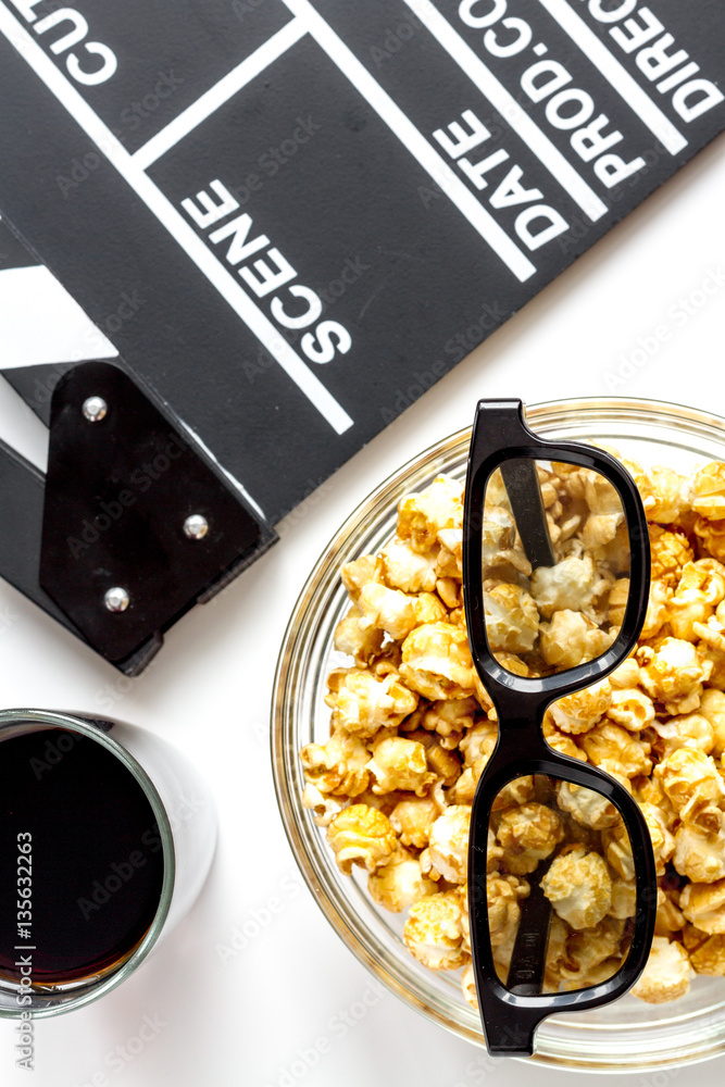 concept of watching movies with popcorn top view white background