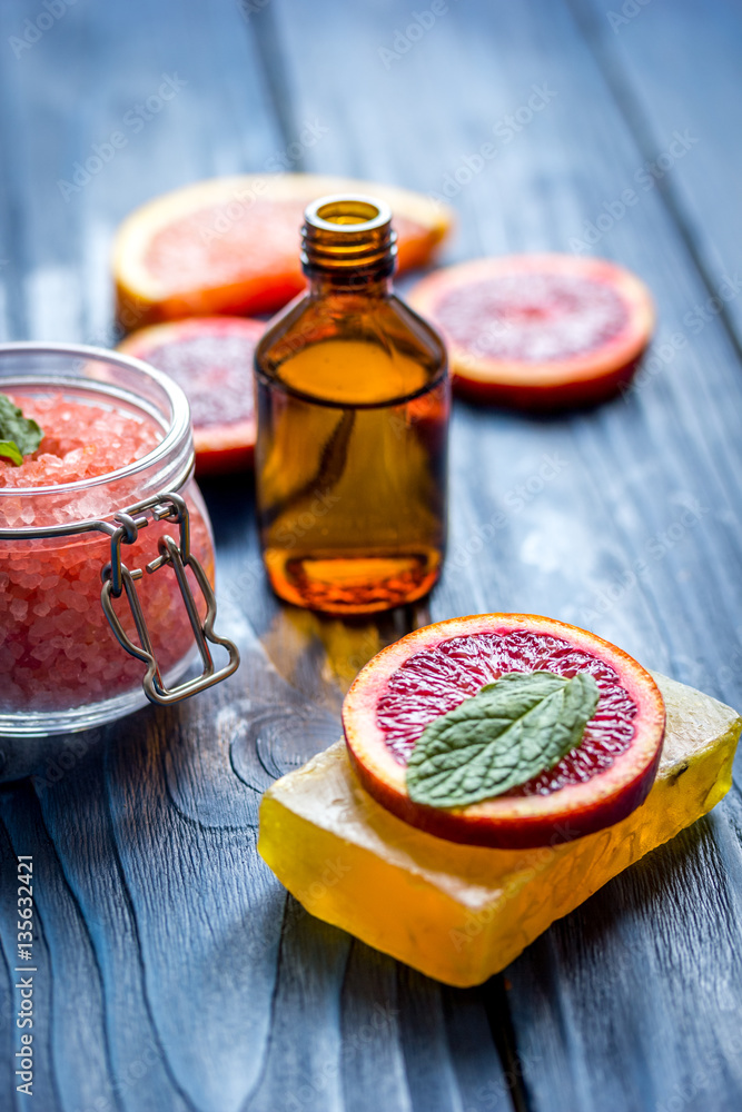 organic cosmetic with citrus on blue background