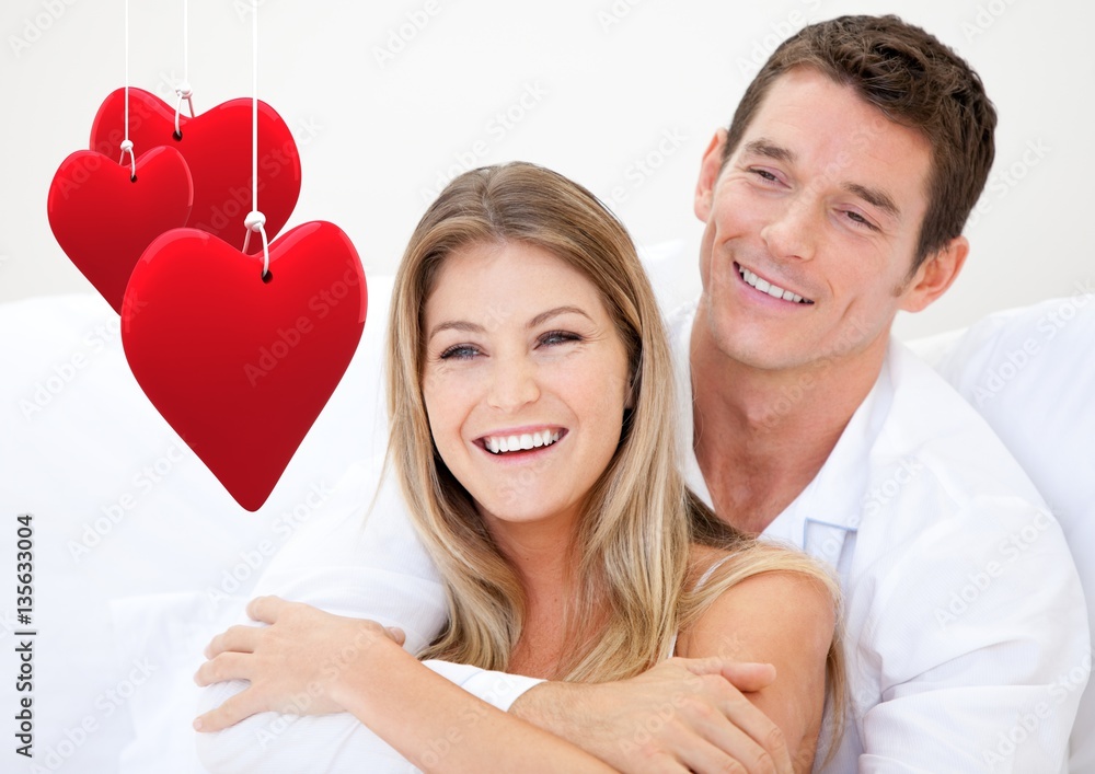 Couple embracing each other against white background