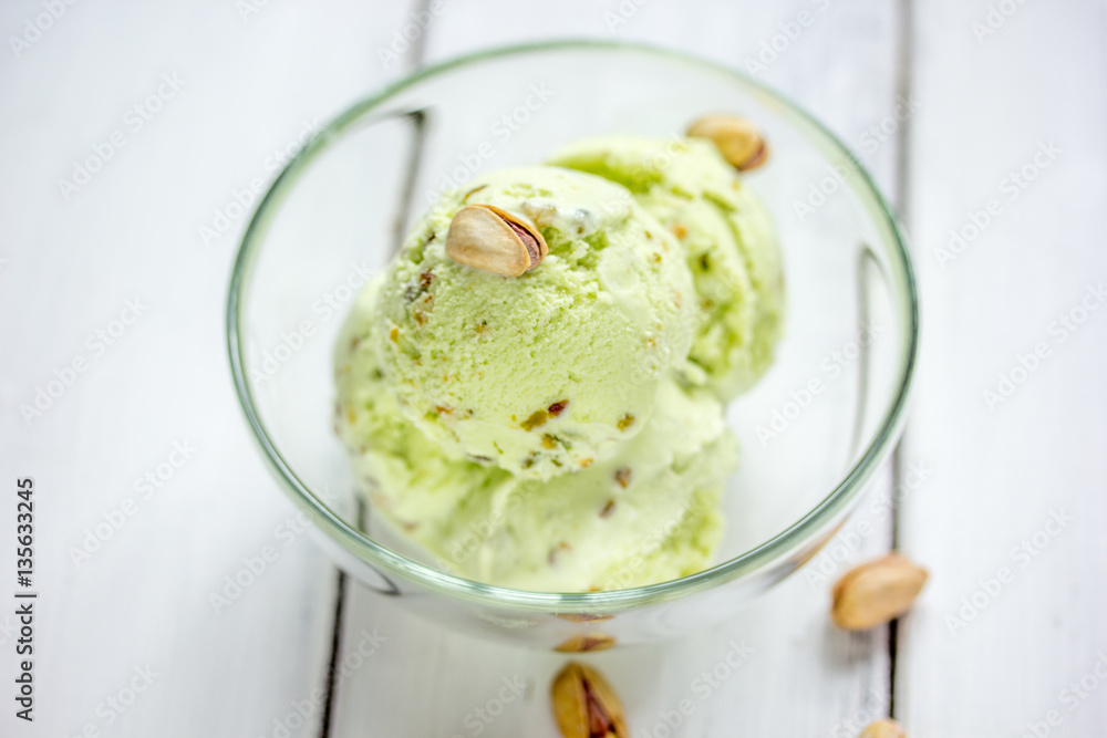 organic homemade ice cream in glass bowl on wooden background