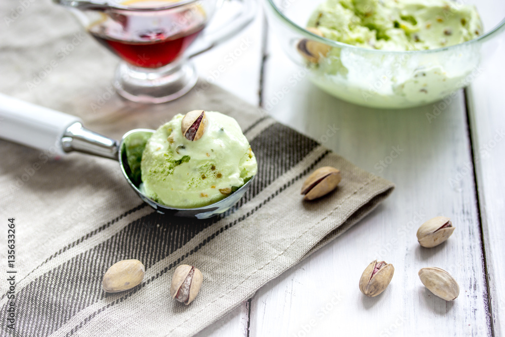 organic homemade ice cream in glass bowl on wooden background