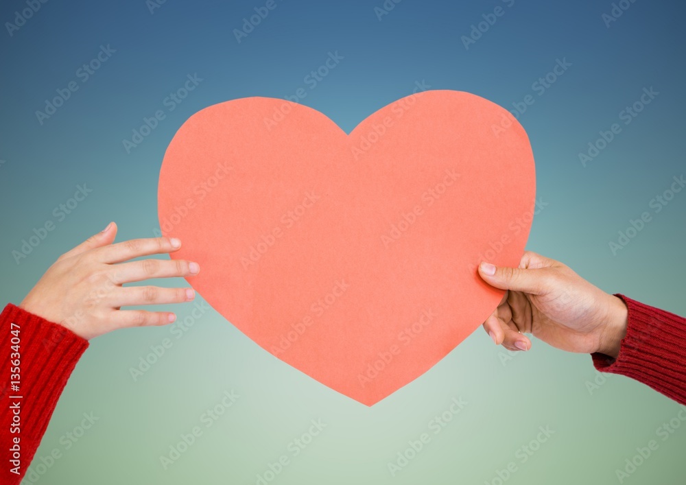 Hands of couple holding a heart