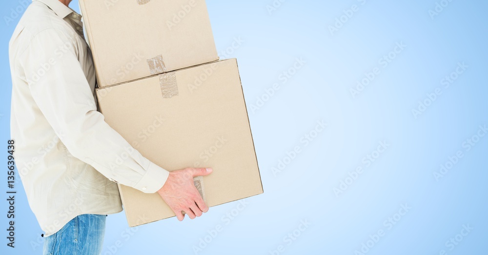 Mid section of delivery man holding cardboard box