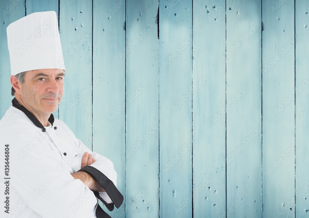 Portrait of male chef cook standing with arms crossed