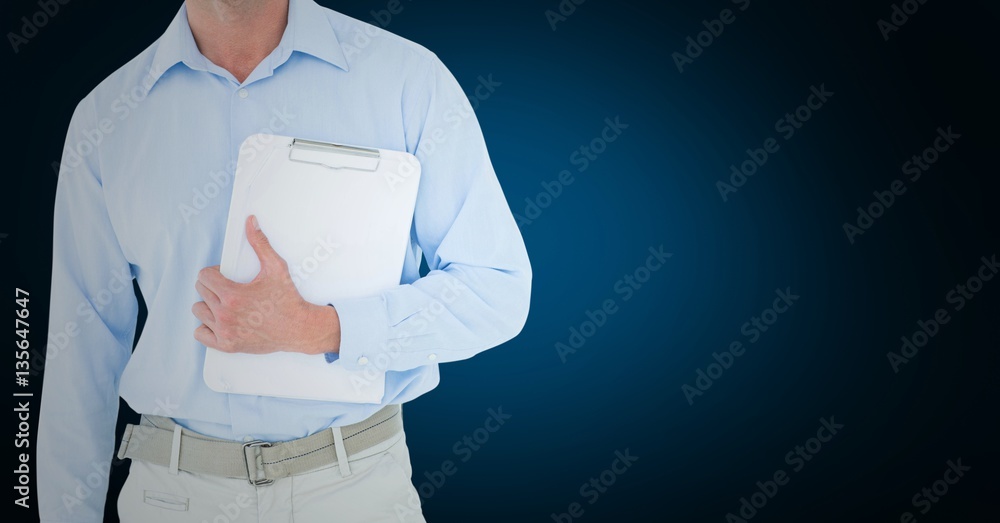 Mid section of delivery man standing with clipboard