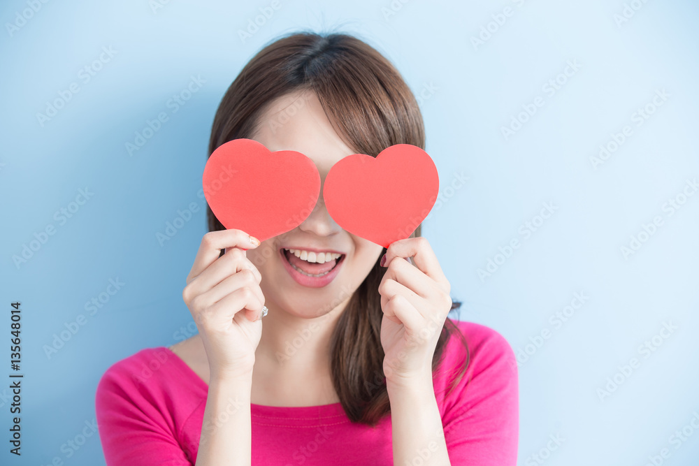 woman holding red love hearts