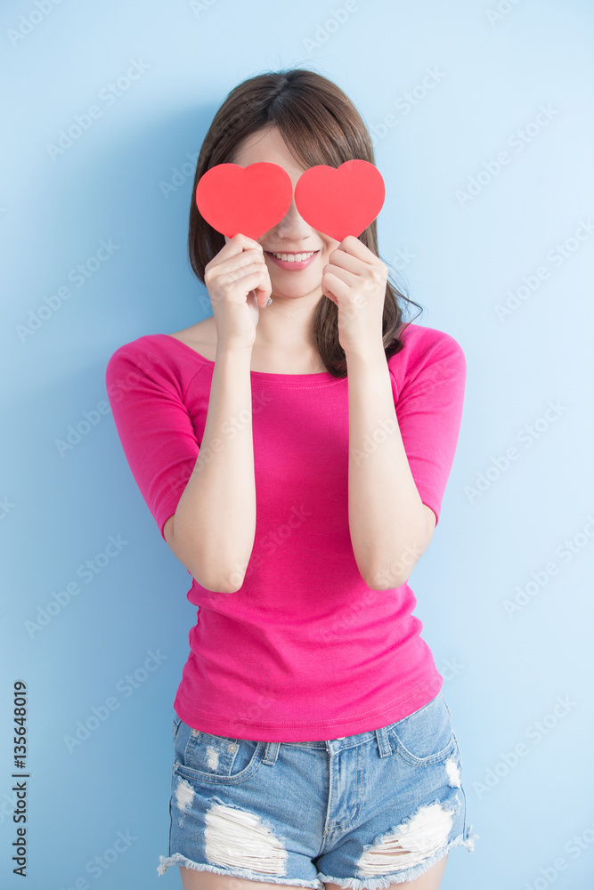 woman holding red love hearts