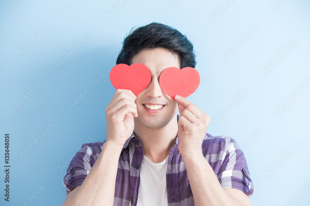 young man holding love hearts