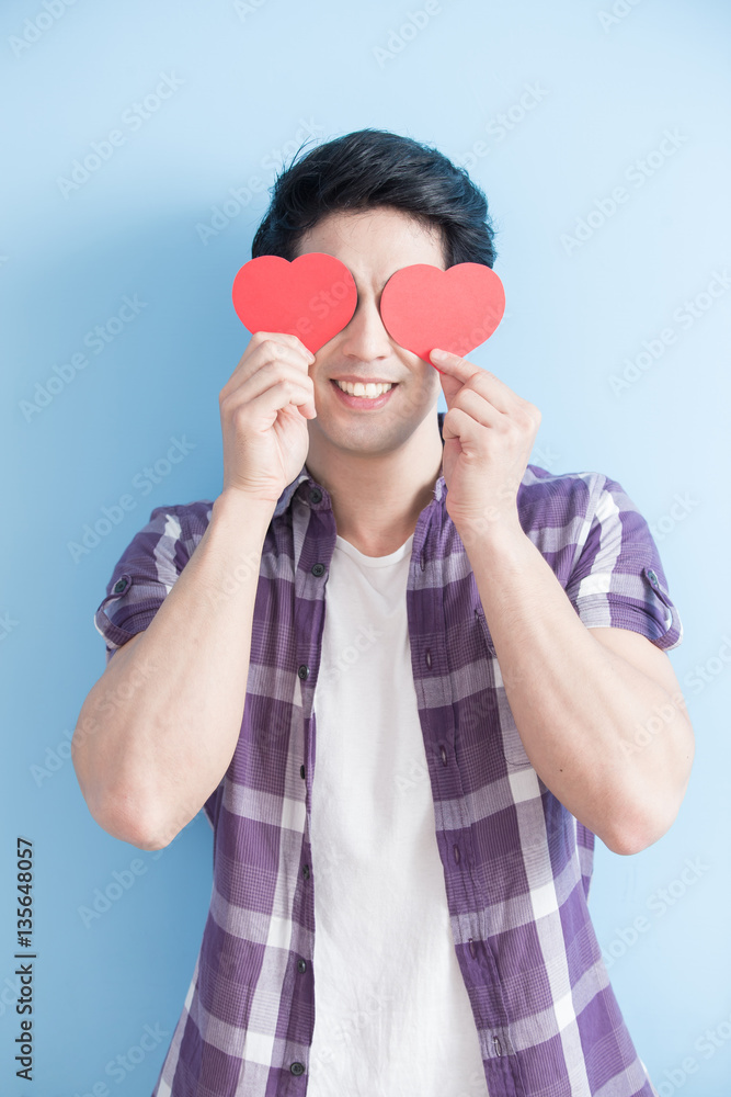 young man holding love hearts