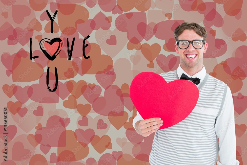 Portrait of happy man holding heart shape