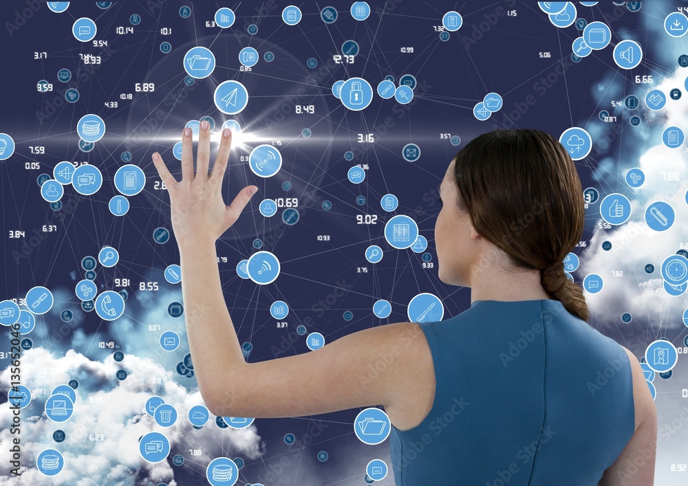 Businesswoman touching digitally generated connecting icons