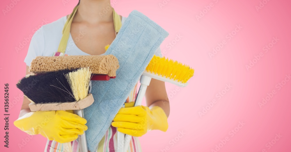 Mid section of woman holding cleaning equipment