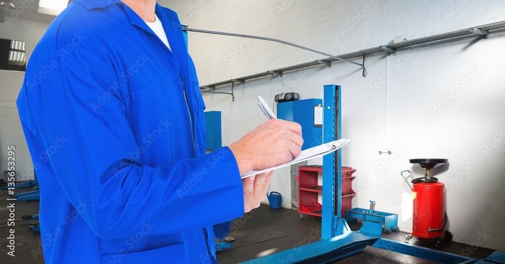 Mechanic writing on clipboard