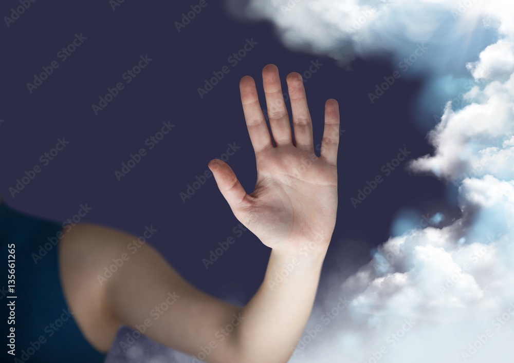 Digitally generated image of hand next to cloud