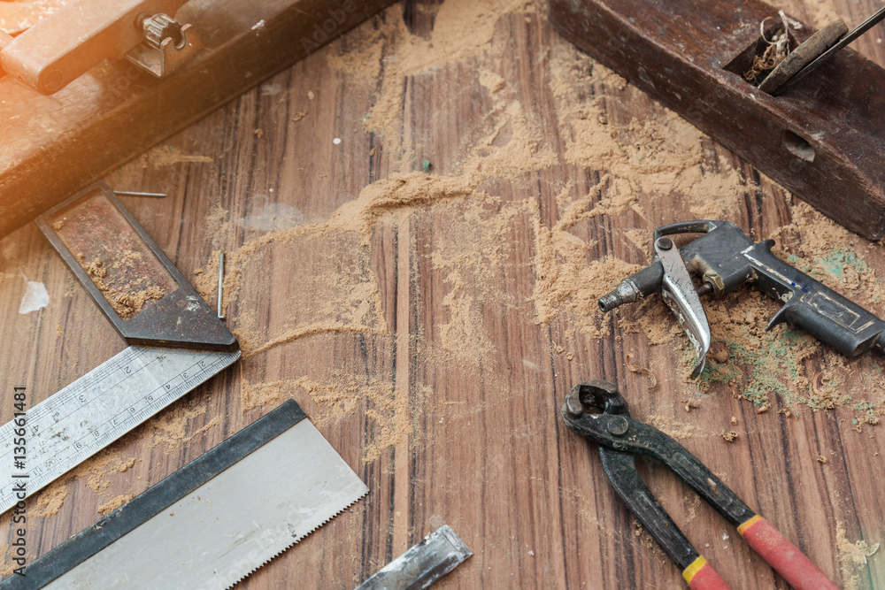 wood workshop with handcraft tools and raw wood on construction