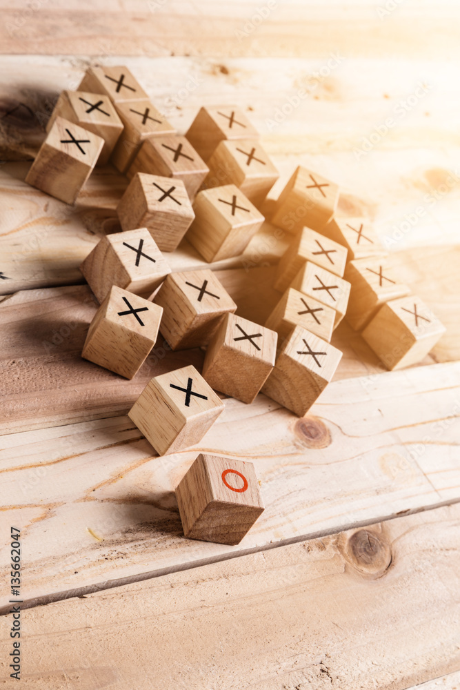 wooden block with right and wrong symbol on block with wooden fl