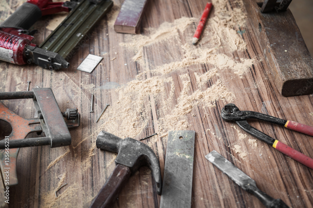 wood workshop with handcraft tools and raw wood on construction