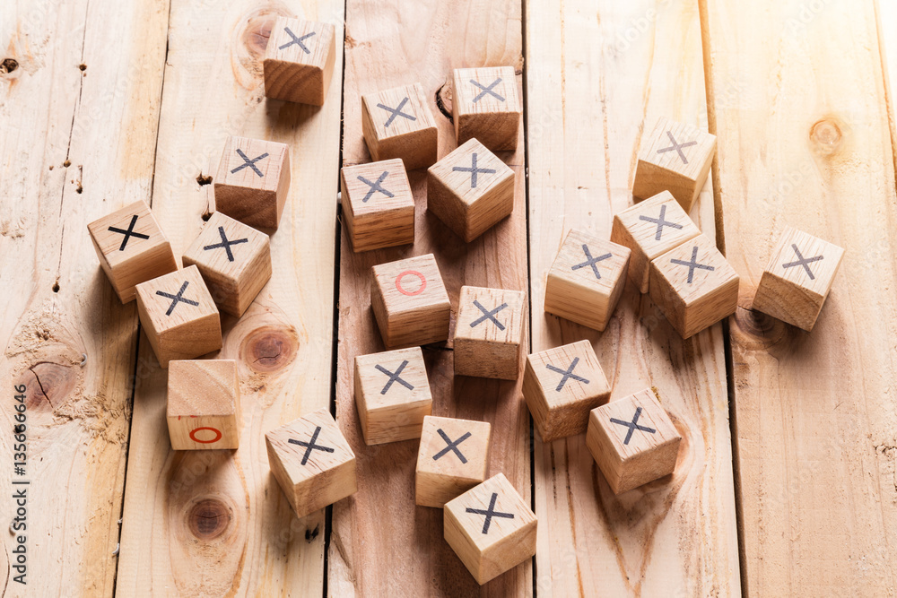 wooden block with right and wrong symbol on block with wooden fl