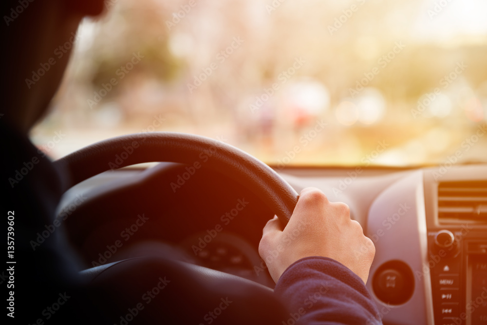 Driving car hands on steering wheel