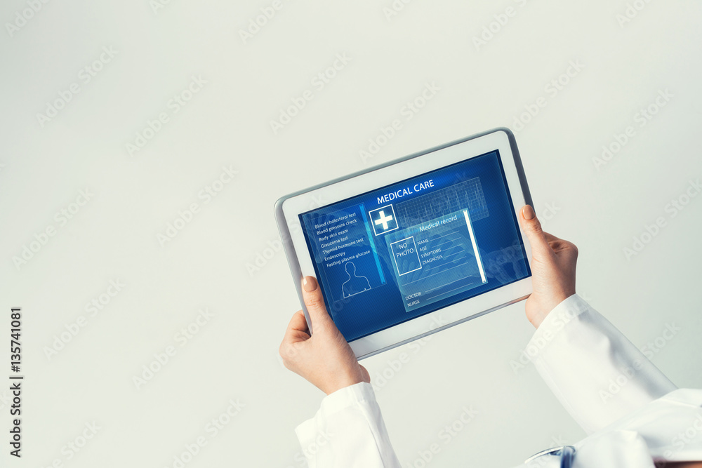 Close of female doctor hands working with tablet pc computer