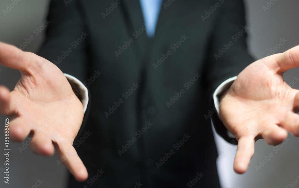 Businessman showing his empty hand