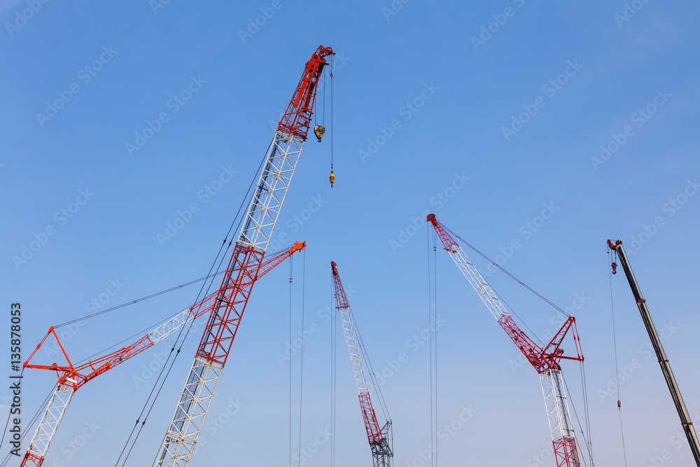 Close - up big red crane at construction site