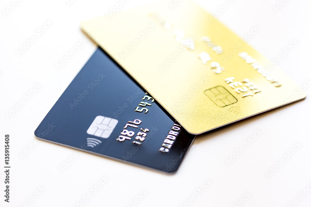 pile of credit cards on white background