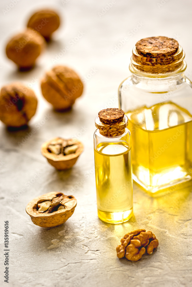 cosmetic and therapeutic walnut oil on gray background