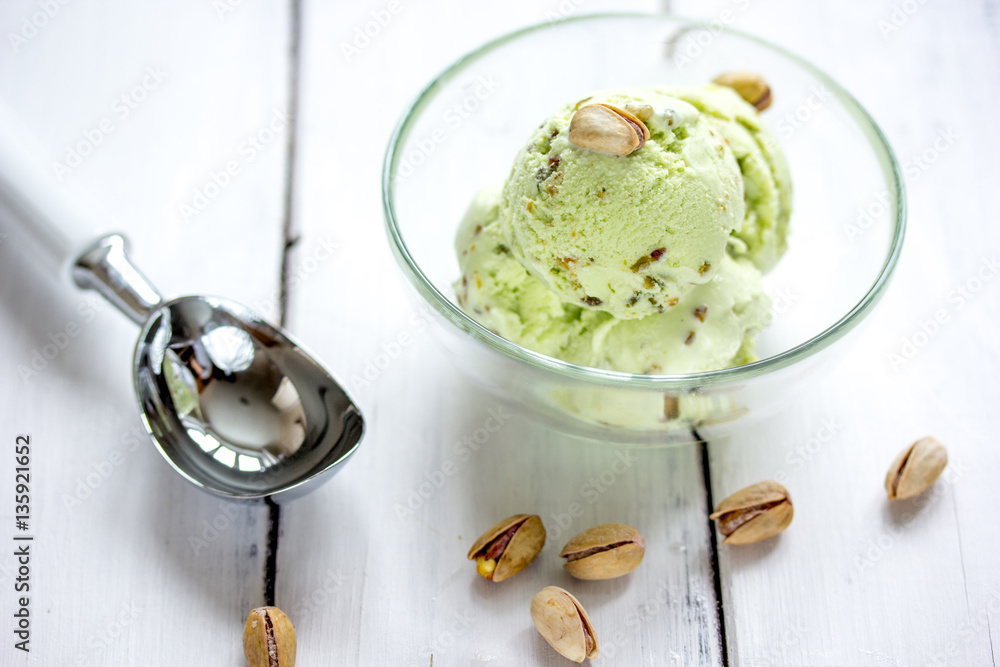 organic homemade ice cream in glass bowl on wooden background