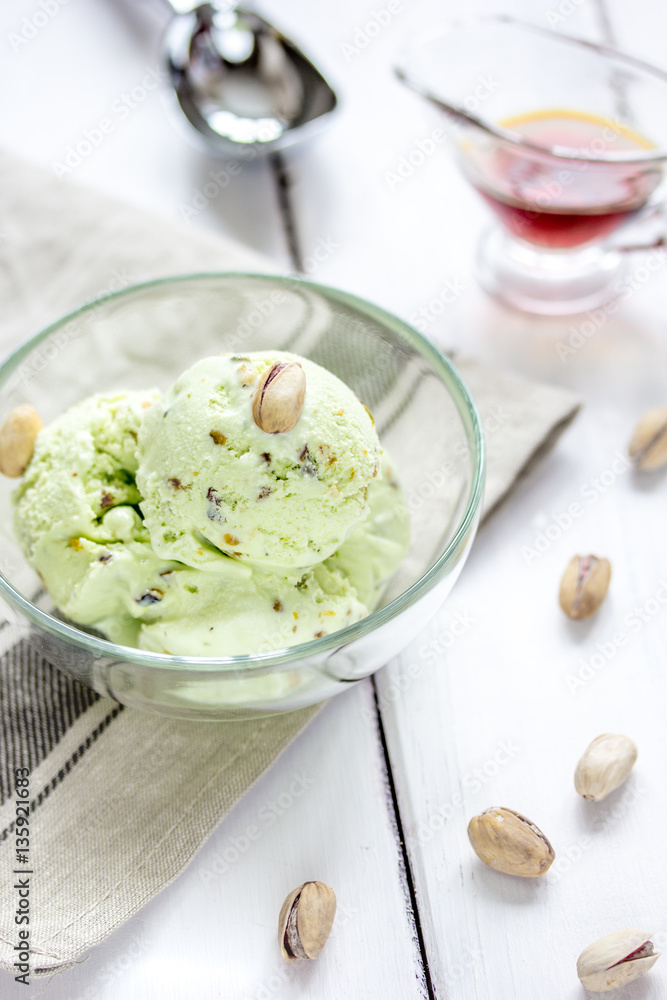 organic homemade ice cream in glass bowl on wooden background