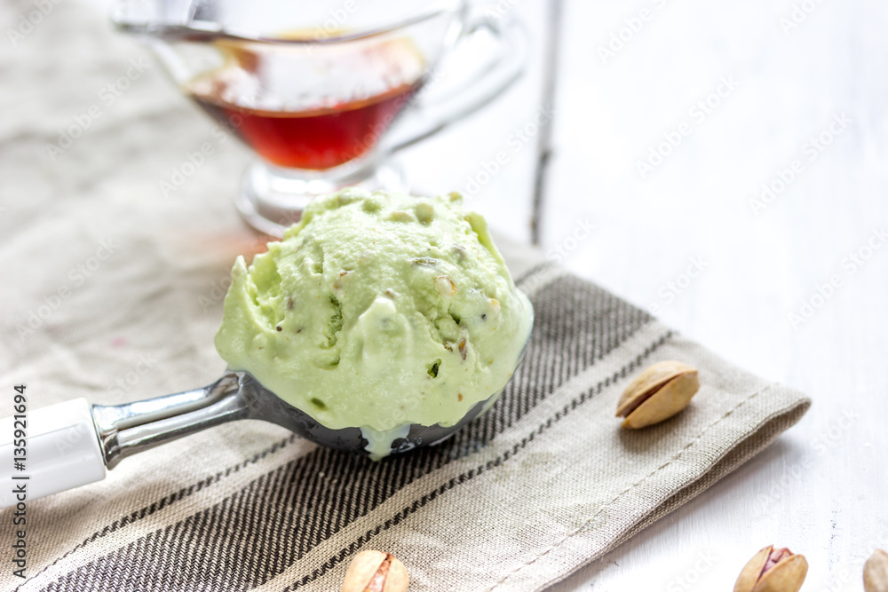 organic homemade ice cream in glass bowl on wooden background