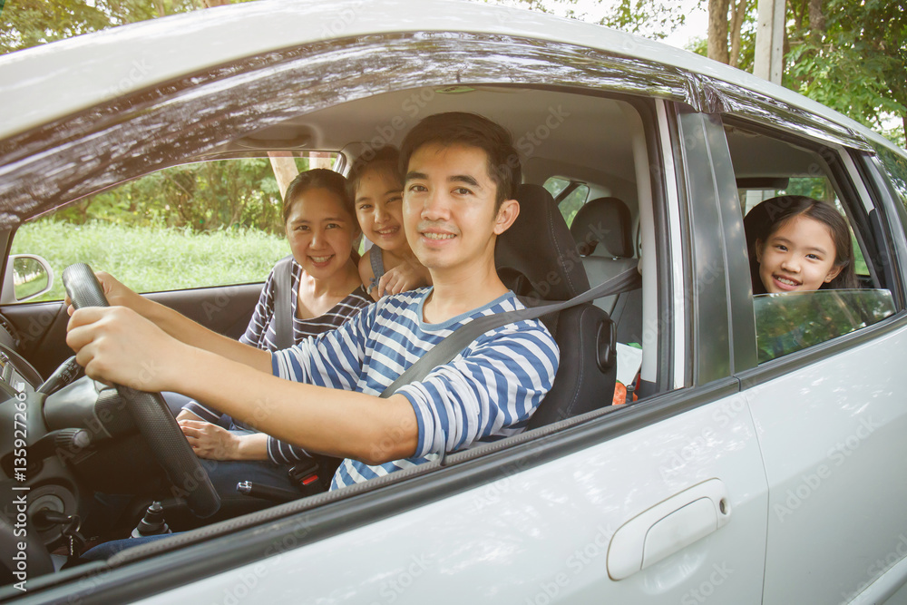 Happy Asian family on mini van are smiling and driving for travel on vacation