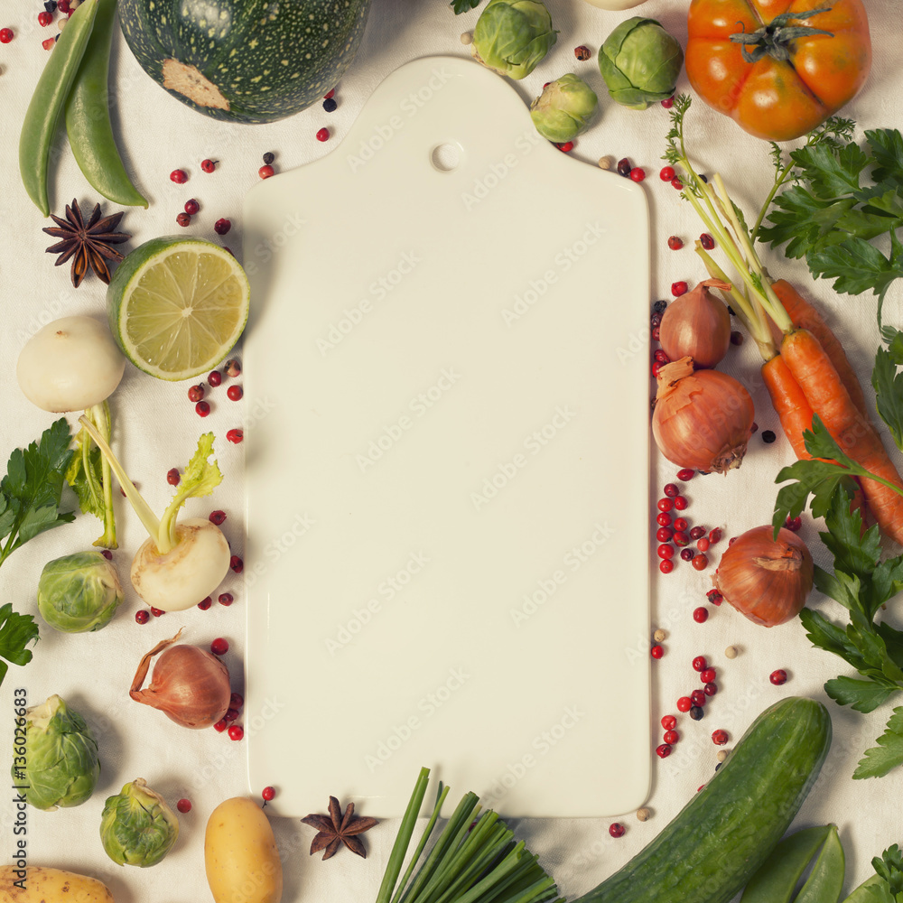 Frame of organic vegetables on white