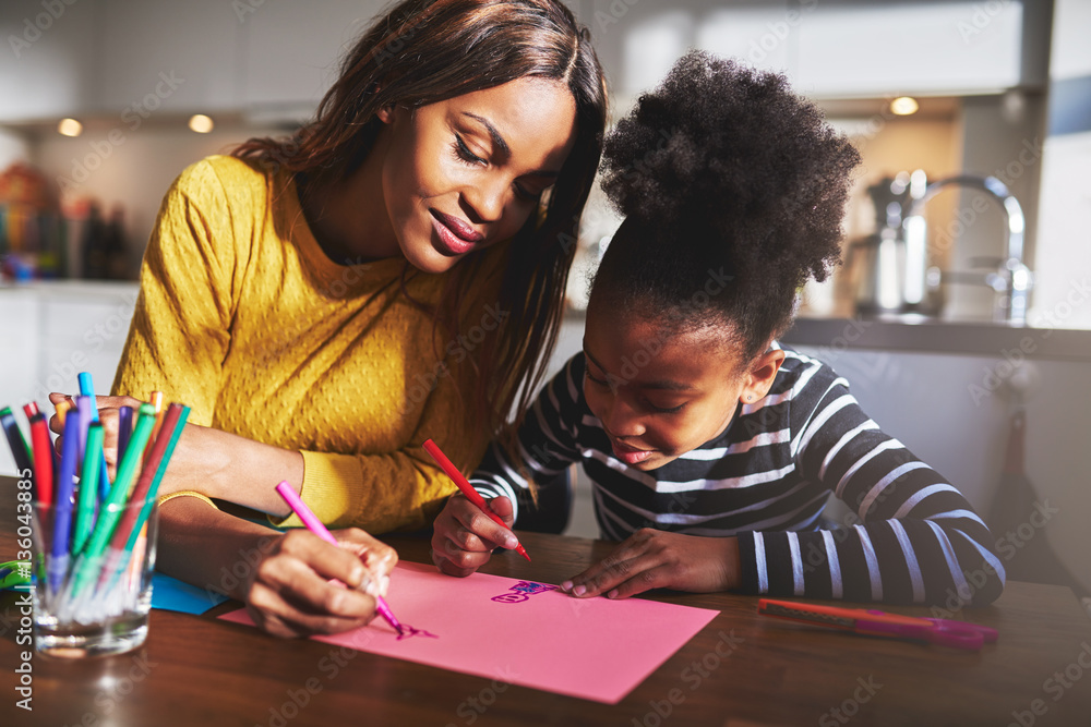 Black mother and daughter drawing