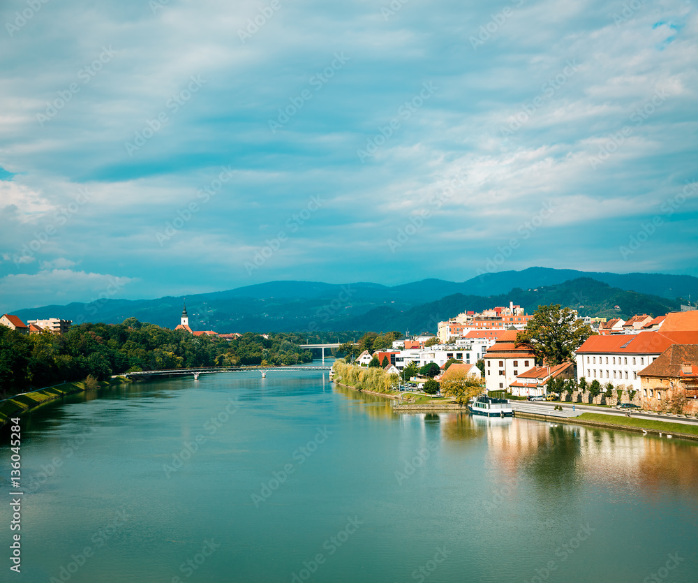 Maribor Old Town View and Drava River on Mountains Background. Popular Touristic Destination in Slov