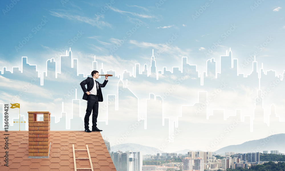 Engineer man standing on roof and looking in spyglass. Mixed med