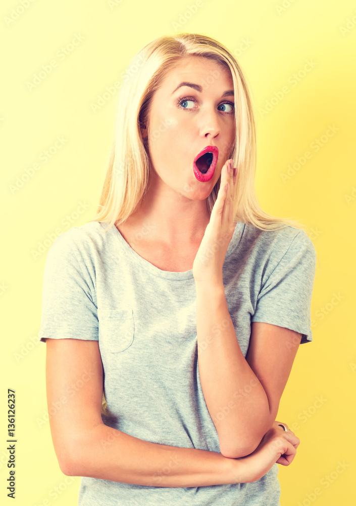 Surprised young woman posing