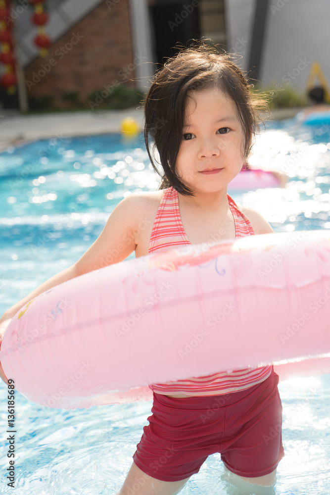 Child in swimming pool, vacation concept