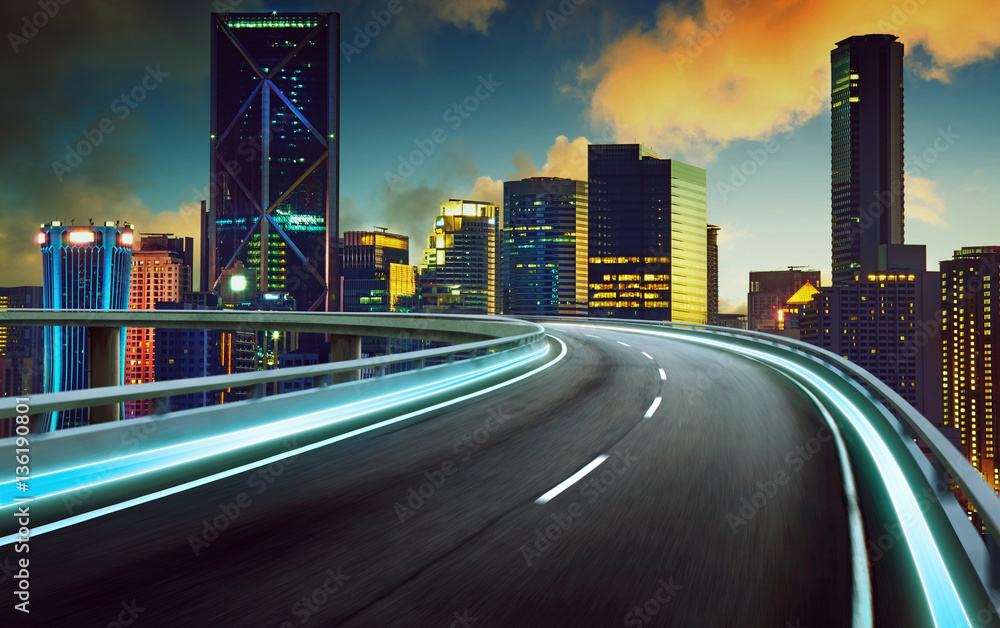 Highway overpass motion blur with city background . night scene .