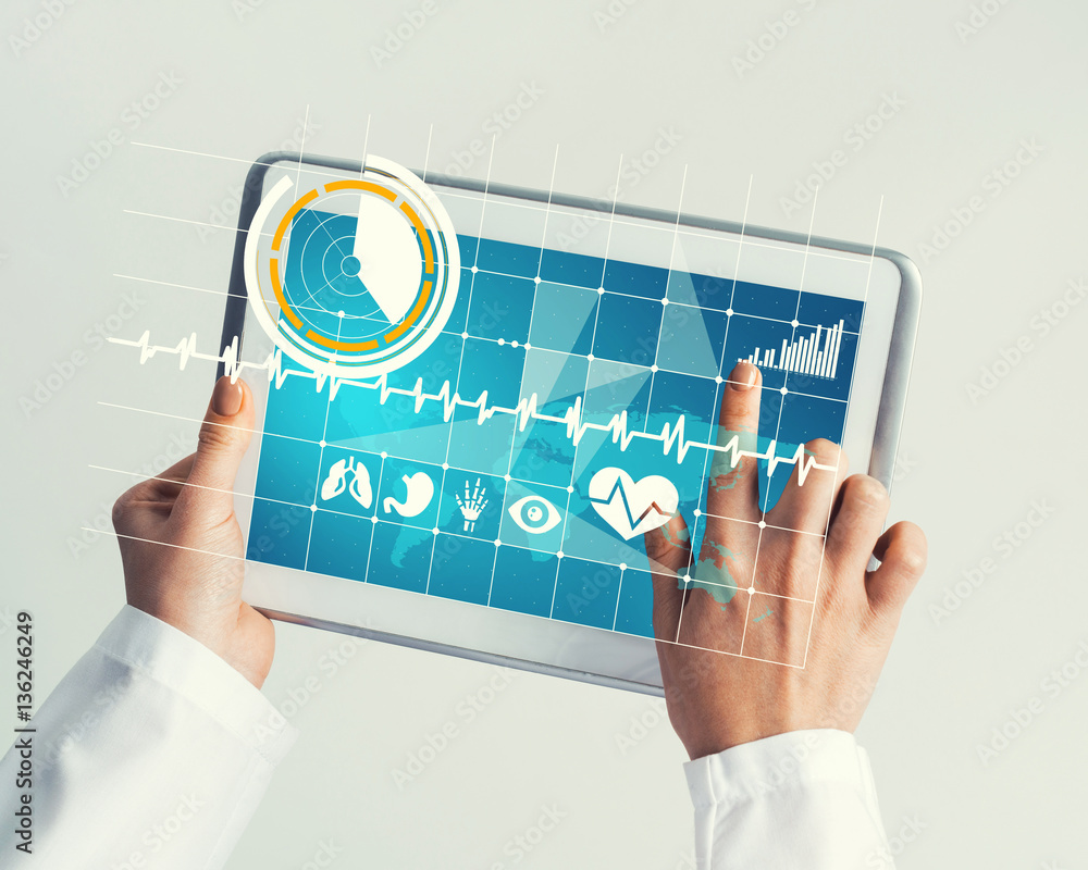 Close of female doctor hands working with tablet pc computer