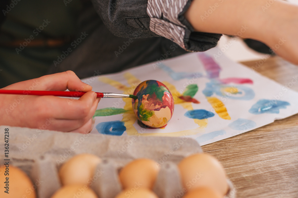 Kid Painting easter eggs