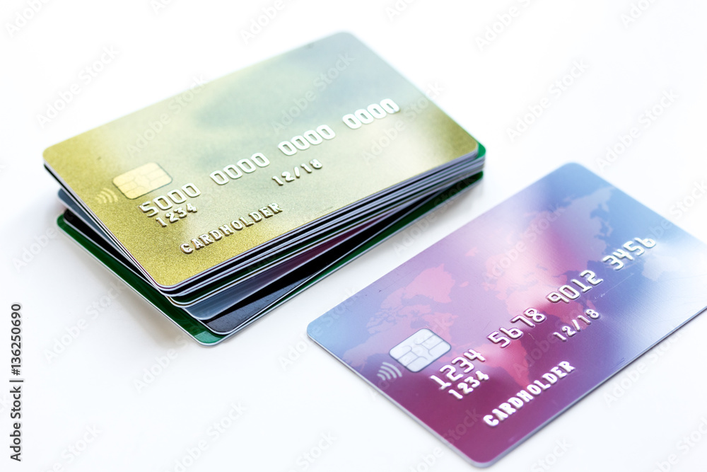 pile of credit cards on white background