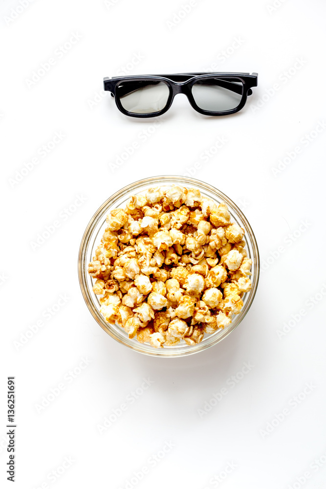 concept of watching movies with popcorn top view white background